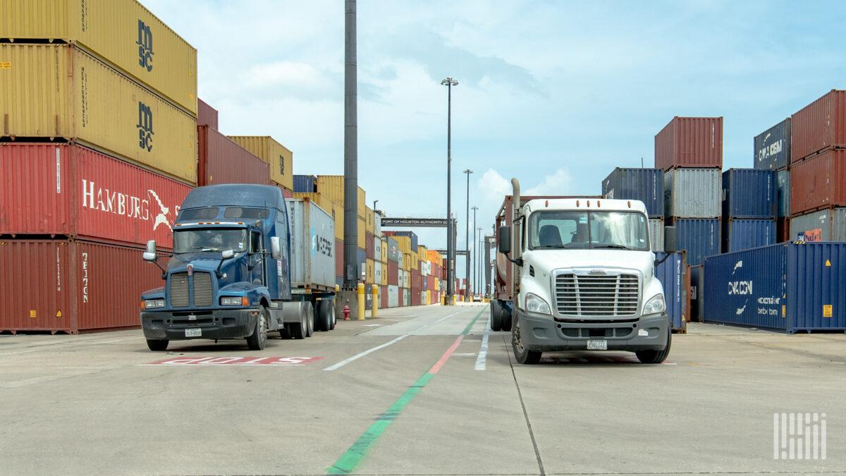 trucks with containers at a port 1200x675 1